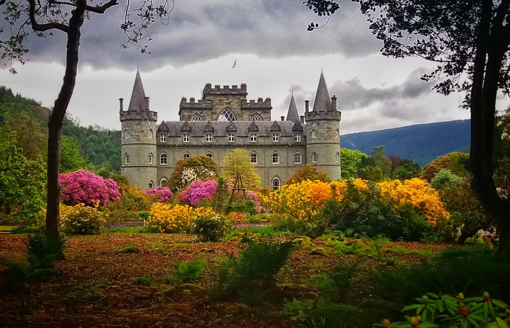 Inveraray Castle framed by flowers