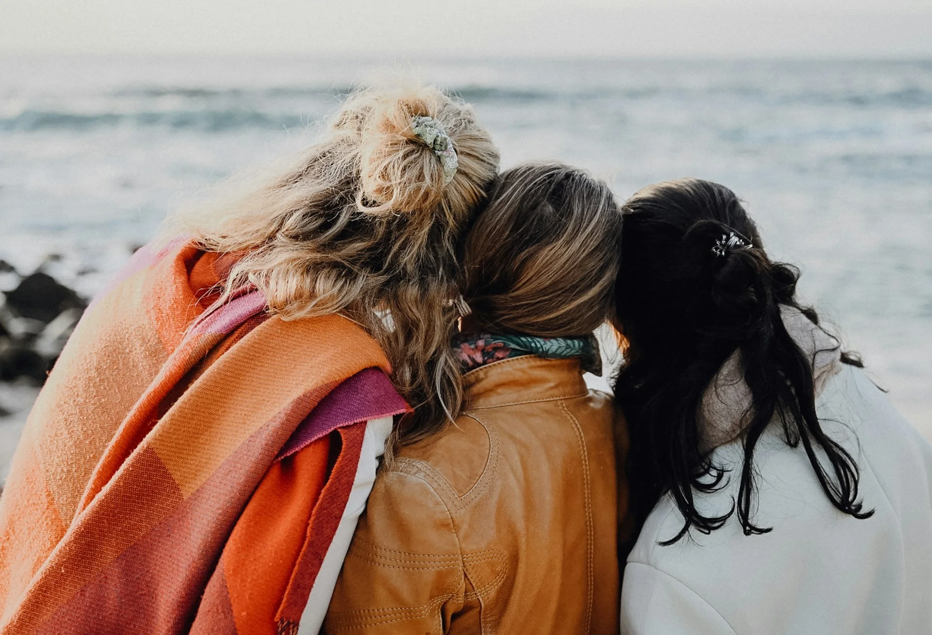Women together beside a Scottish lake